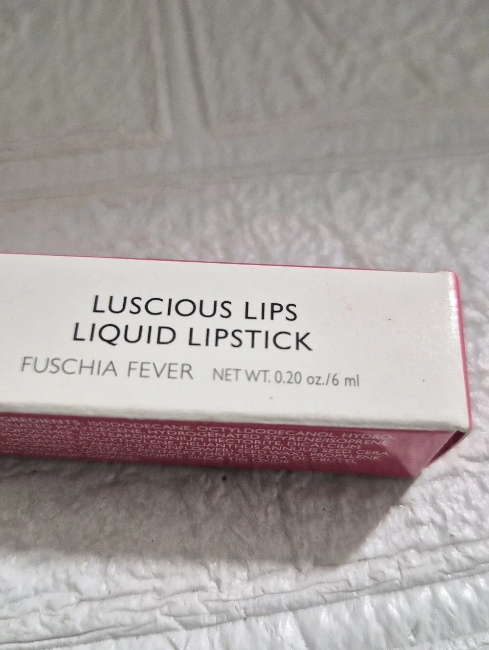 Laura Geller Luscious Lips Liquid Lipstick packaging in the shade Fuschia Fever